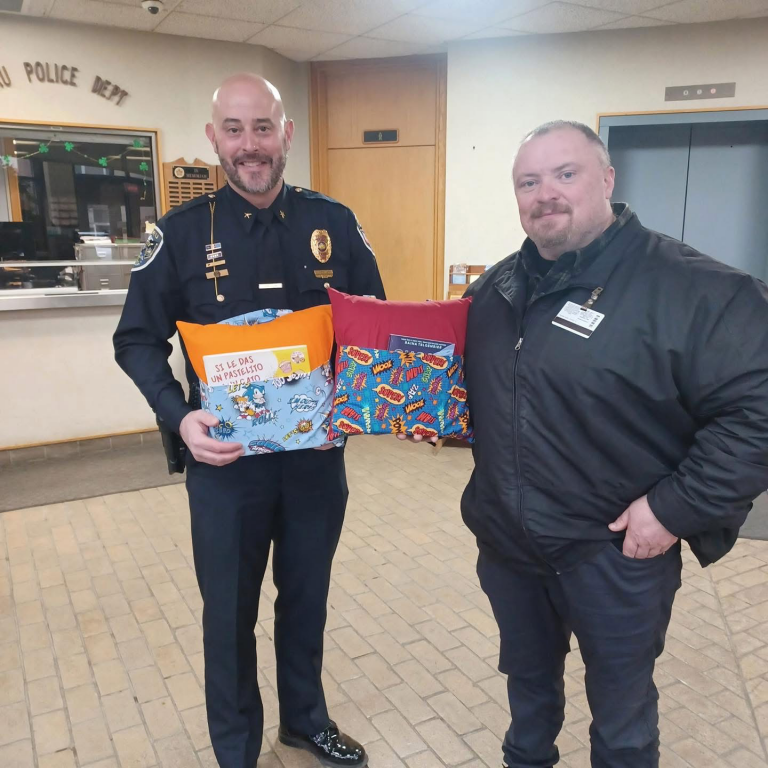 Miami Correctional Facility presents Book Pillows of Hope to Peru Police Department